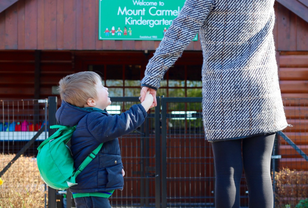 Child holding his Mummy's hand outside Mount Carmel Kindergarten