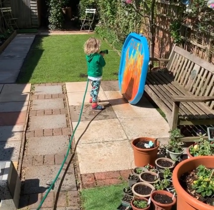 A picture containing outdoor, grass, holding, building

Description automatically generated